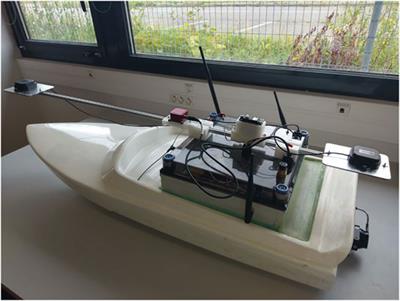 An Online Interval-Based Inertial Navigation System for Control Purposes of Autonomous Boats